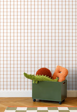 Papier peint Quadrille coloris Terracotta Doux dans une chambre d'enfant avec jouet crocodile